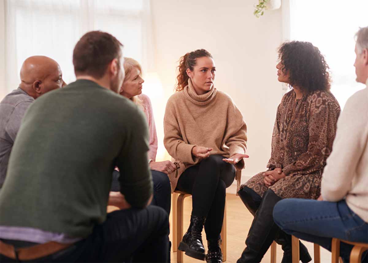 Counselor leading group therapy