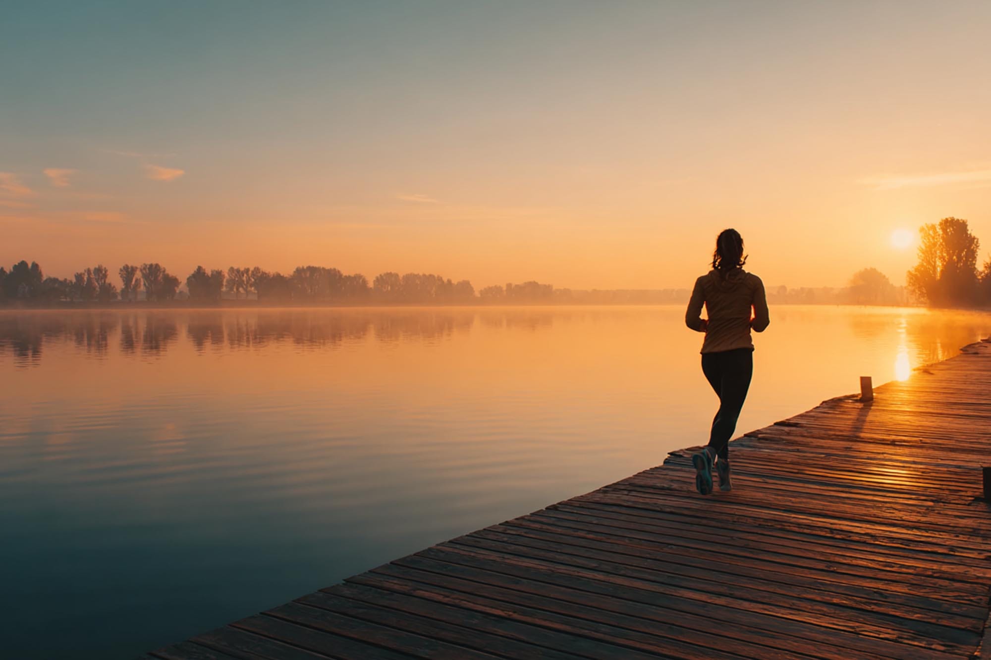 person jogging sunrise by water, wellness lifestyle photography, hopeful vibe